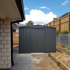 insitu image of the 10x10 Lotus Metal Shed in Anthracite Grey -