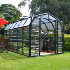 8x12 Palram Canopia Rion Clear Grand Gardener Greenhouse - in situ, angle view