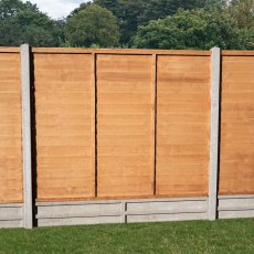 Forest Heritage 5ft lap fence panels fitted between concrete posts on a lawned garden boundary
