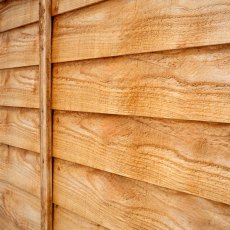 Angled close-up view of Forest Heritage lap fence panel highlighting overlapping timber slats.