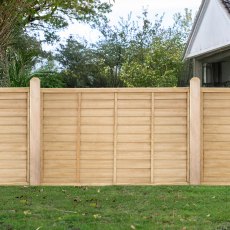 4ft high Forest Signature pressure treated lap fence panel installed in a garden setting