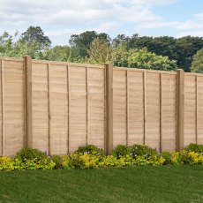 5ft high Forest Signature pressure treated lap fence panel installed in a garden setting