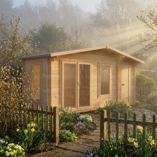 Shire Spalding 16x6 log cabin with double doors and side windows in a garden
