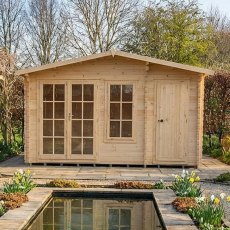 Front elevation view of the 14x8 Shire Bourne timber log cabin situated near a garden pond with doors closed.