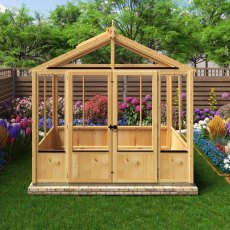Shire Holkham 8x4 wooden greenhouse with glazing and garden plants