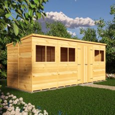 Angled side view of Shire 16x6 shiplap pent wooden shed in outdoor garden