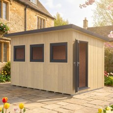 Angled exterior view of the 12x8 Shire Fortis insulated garden office in a landscaped setting