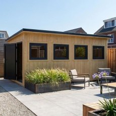 Shire Fortis 16x8 insulated garden building shown next to outdoor seating area