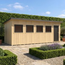 Exterior front view of the Shire Fortis 20x8 insulated garden building surrounded by landscaping