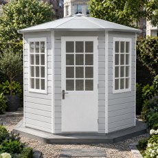 Corner perspective showing two windows of the light grey painted Shire Arreton 8x8 hexagonal timber garden room.