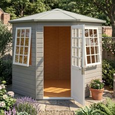 Angled view of the grey painted 8x8 Shire Arreton hexagonal wooden summerhouse set in a landscaped garden with door open.