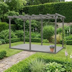 Shire 16x8 dark grey wooden pergola structure with decking set on a manicured lawn next to a garden pathway