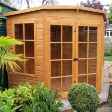 8x8 Shire Hampton Premium Corner Summerhouse - Customer image with bushes