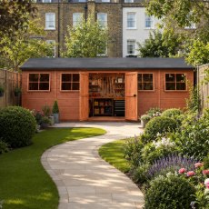 Shire mammoth 10x25 apex wooden garden shed with double doors open to an interior workshop and multiple opening side windows.