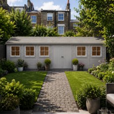 Shire mammoth 10x30 apex wooden garden shed with double doors open to an interior workshop and multiple opening side windows.