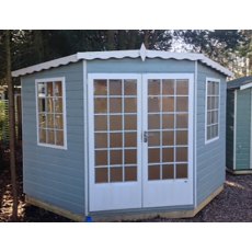 7 x 7 Shire Gold Windsor Corner Summerhouse - front view painted blue with white fascia windows and