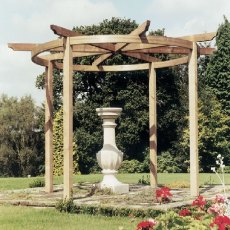 Grange Carousel Garden Pergola - lifestyle with vase as a centre piece