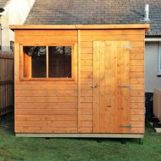 Front view of Shire 8x6 shiplap pent shed with window and single door