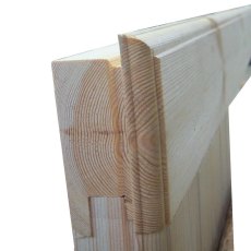 Detail shot showing a cross-section of the interlocking corner joint of the timber logs used in the cabin's construction.
