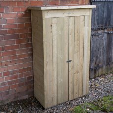 Closed pent roof tall timber garden storage unit positioned beside house wall and fence