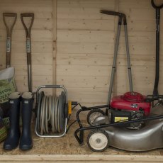 Interior storage space of Forest Shiplap Pent Large Outdoor Store 6x3 with lawnmower and tools
