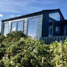 Thorndown Wood Paint - Bishop Blue - Painted on a wooden garden shed