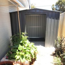 insitu showing double door opening on the 10x10 Lotus Metal Shed in Anthracite Grey
