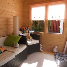 12Gx12 Shire Belgravia Log Cabin (28mm Logs) - internal used as a relaxing room