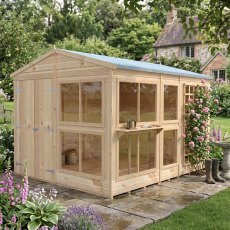 8x10 Shire Sun Hut Potting Shed with glazed windows and timber door in a garden setting