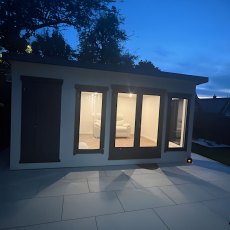 16 x 12 Shire Cali Insulated Garden Office With Side Storage front view at night