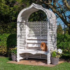 Shire Bejoda wooden garden arbour bench with arched roof set in a sunny lawn.