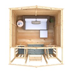Shire Thornham 7x5 summerhouse interior furnished with seating and table