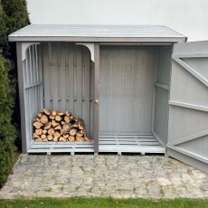5x2 Shire Country Pent Log Store with Storage - Pressure Treated - in situ, front view