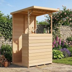 Angled front view of the wooden Shire Tiki Garden Bar set on a paved patio in a lush garden setting.