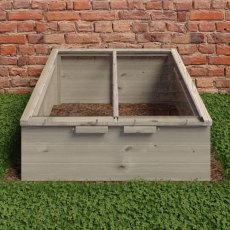 Front view of the Shire Holkham 4x3 wooden cold frame greenhouse with closed glass panel lids on grass.