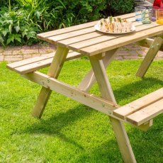 Rowlinson Traditional 6 Seater Picnic Table 1.5m - Pressure Treated - in situ, angle view, side view