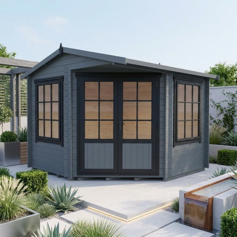 Grey painted Shire Rochester corner log cabin with double glass doors in a garden setting