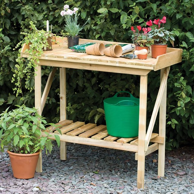 Forest Potting Bench Pressure Treated - 3'6" Long - with background and in use