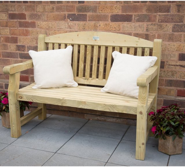 4ft Forest Harvington Bench - Pressure Treated - insitu with decorative cushions