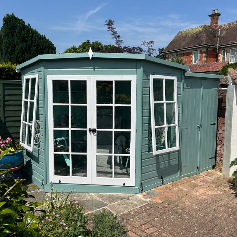 7x11 Shire Hampton Premium Corner Summerhouse with Side Shed, in situ