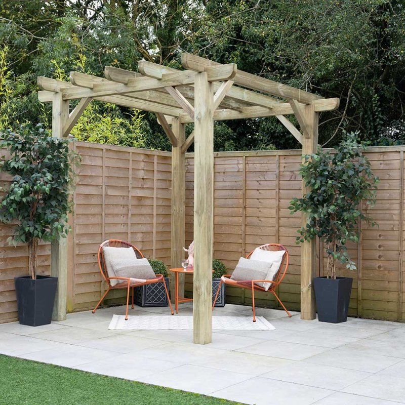 8x8 Forest Premium Ultima Wooden Garden Pergola - displayed with outdoor chairs