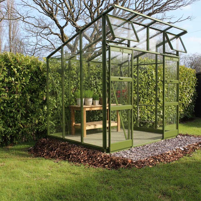 Elite Edge 600 6x8 Pent Roof Greenhouse - angled view in olive - in olive with potting bench
